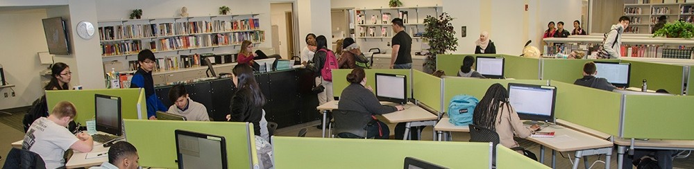 UCBA Library information desk and computer stations