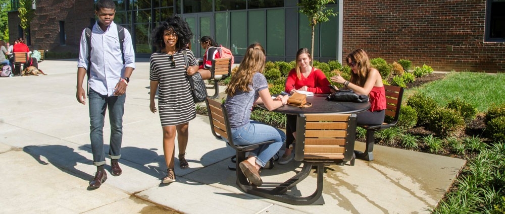 students walking outside Progress Hall