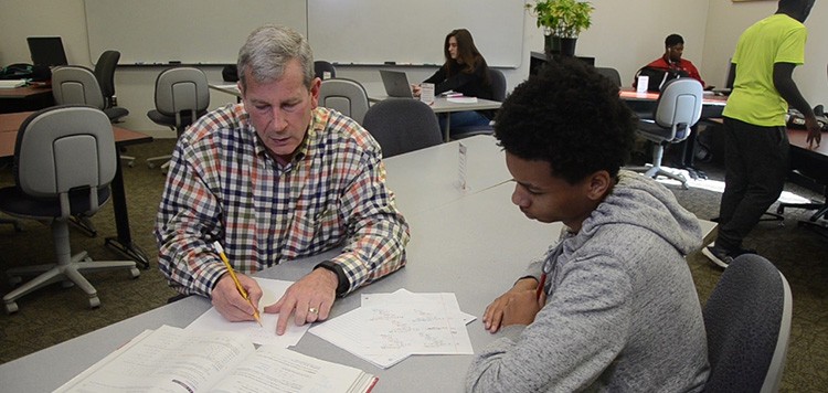 Kevin Kellar helping a student in the math lab