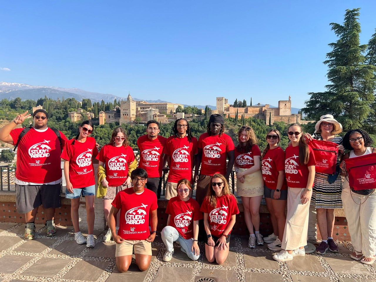 group of UC Blue Ash students posing in fron of Granada, Spain cityscape