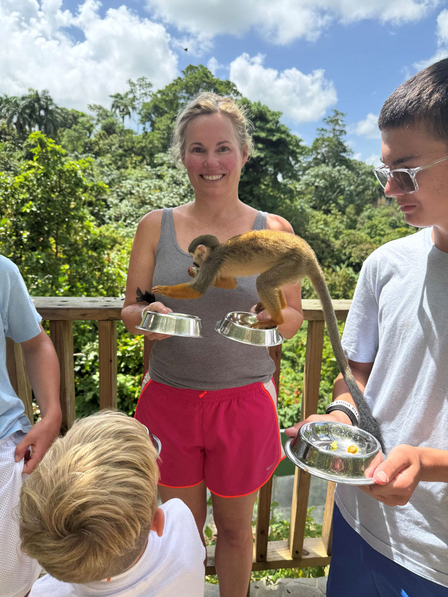 Brandi Thomas posing with a monkey