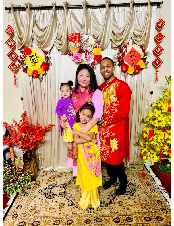 Emily with husband and two daughters at Lunar New Year