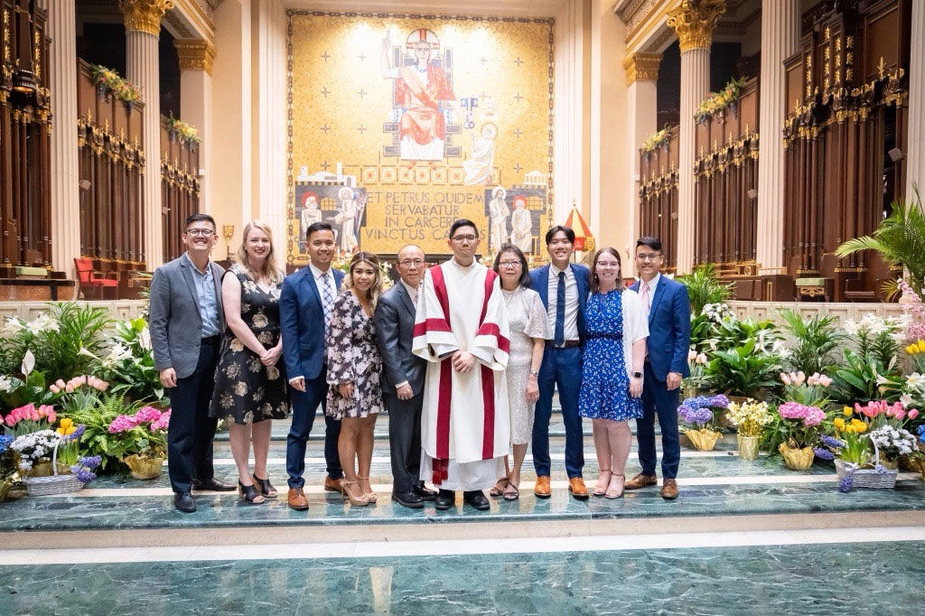 large family group posing inside church