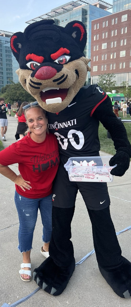 Missy Graf posing with the bearcat mascot