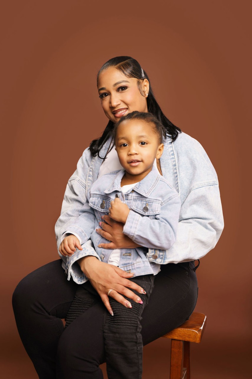 Mother and son seated and smiling