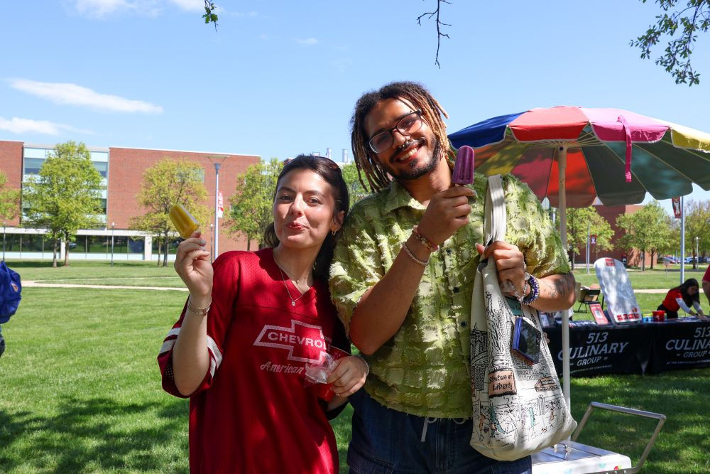 two students outside with popsicles at UC Blue Ash College