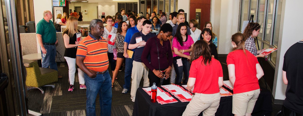 Student and parent group attending orientation in Muntz Hall